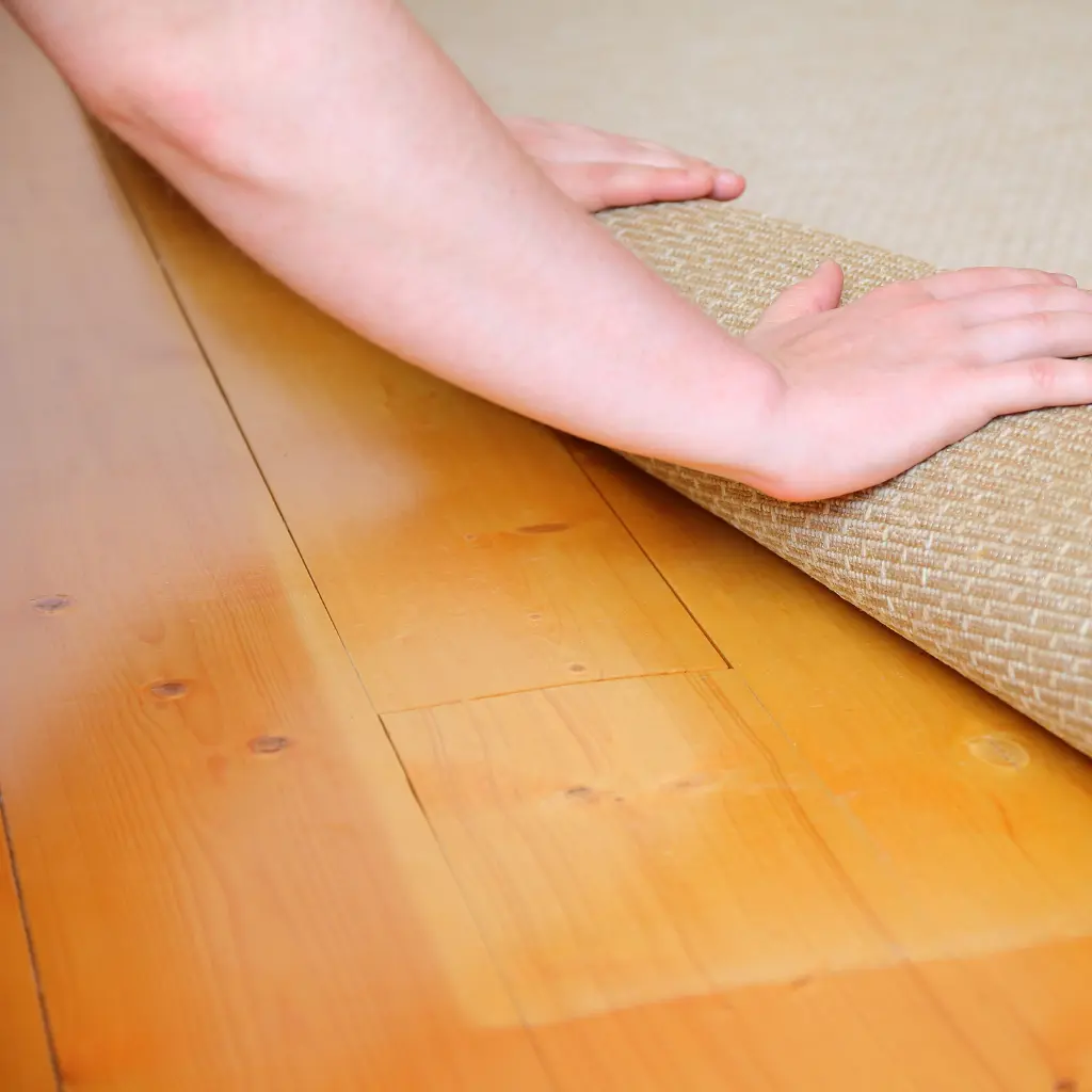 how to repair a squeaky floor under carpet